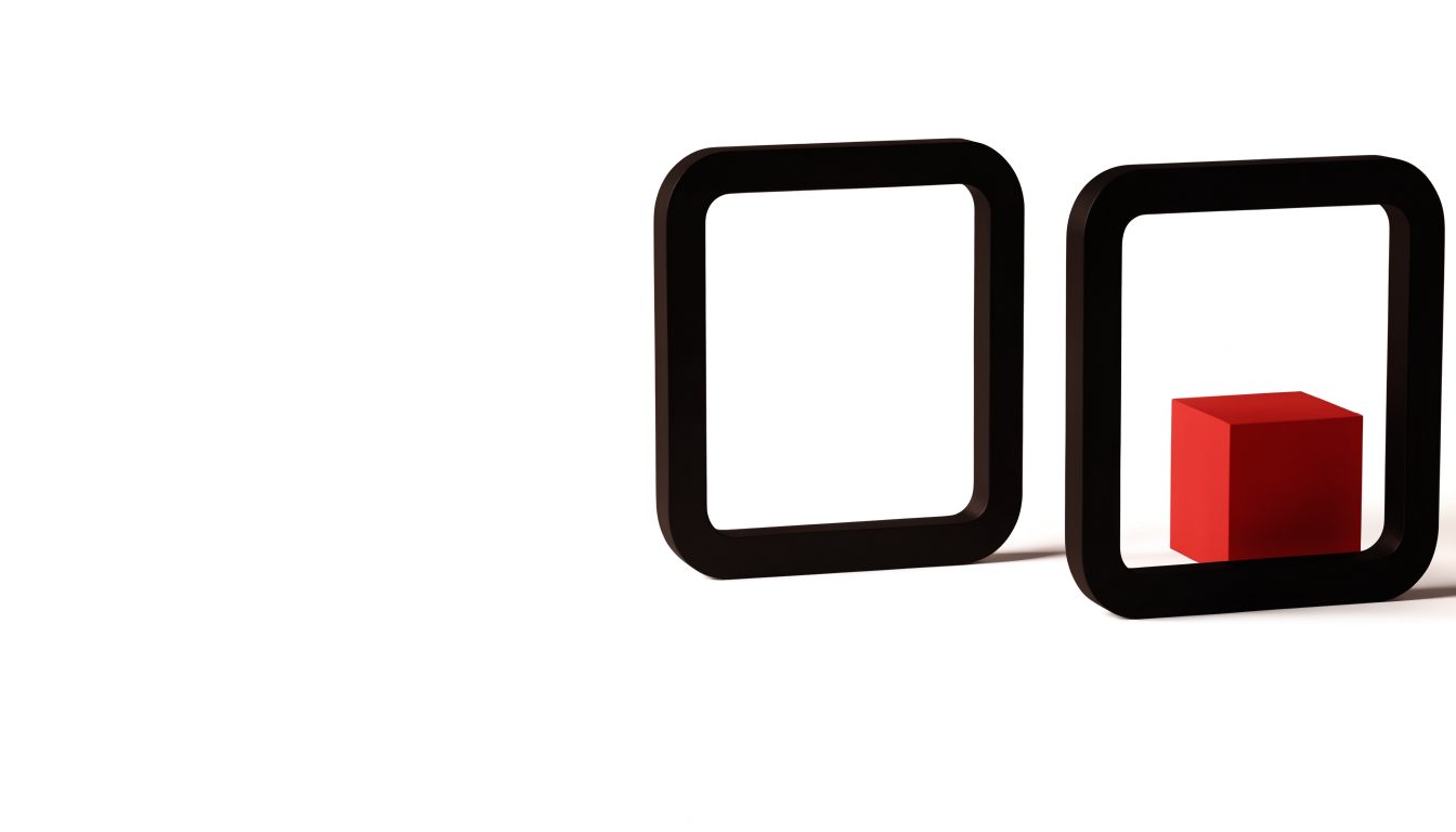 Two black frames on white; the right one holds a small red cube